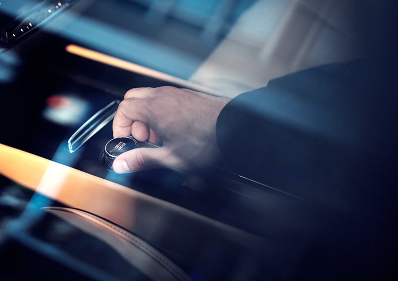 The driver of a 2023 Lincoln Corsair® SUV is shown adjusting the drive mode. | Lincoln Cosmos Demo in Derwood MD